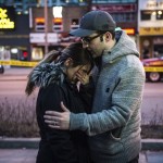 Farzad Salehi consoles his wife, Mehrsa Marjani, who was at a nearby cafe and witnessed the aftermath when a van plowed down a crowded sidewalk, killing multiple people and injuring others, Monday, April 23, 2018, in Toronto. (Aaron Vincent Elkaim/The Canadian Press via AP)