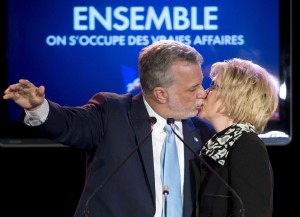 Quebec Liberal Leader Philippe Couillard, left, kisses his wife Suzanne Pilote after giving his victory speech, Monday, April 7, 2014 in St-Felicien Que. THE CANADIAN PRESS/Jacques Boissinot