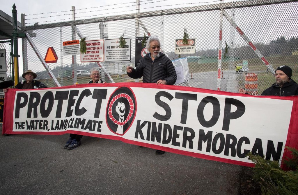 Environmentalist David Suzuki poses with Kinder Morgan protesters in Burnaby, B.C., in March.