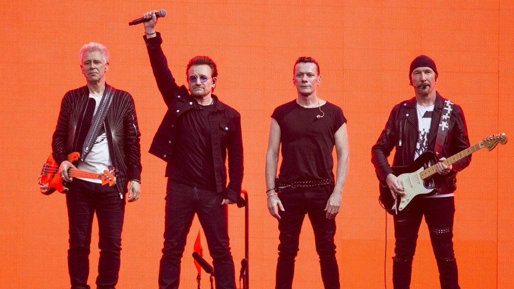 Musicians, Adam Clayton, from left, Bono, Larry Mullan Jnr and The Edge, of the band U2, perform on stage at Twickenham Stadium in London, Sunday, July 9, 2017. (Photo by Joel Ryan/Invision/AP)