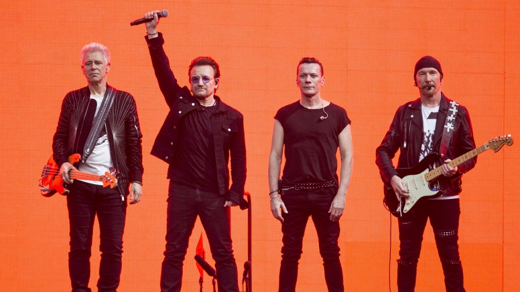 Musicians, Adam Clayton, from left, Bono, Larry Mullan Jnr and The Edge, of the band U2, perform on stage at Twickenham Stadium in London, Sunday, July 9, 2017. (Photo by Joel Ryan/Invision/AP)