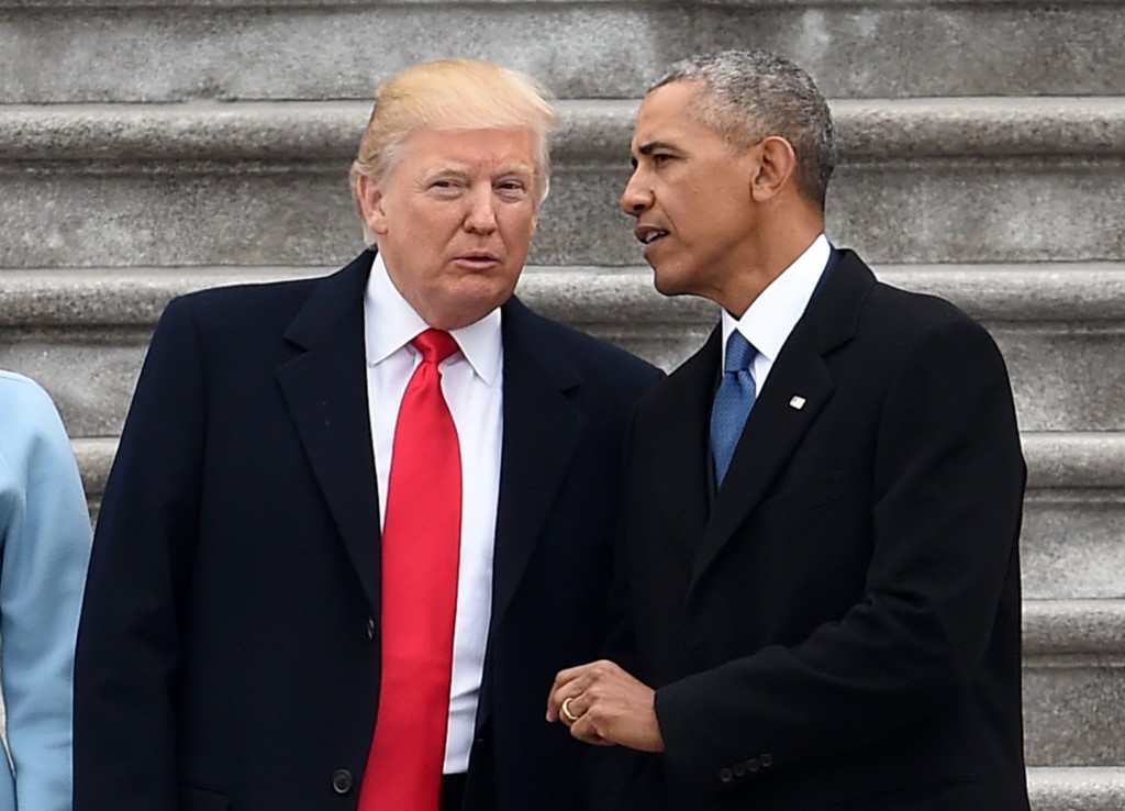 President Donald Trump and former President Barack Obama talk on the East front steps of the US Capitol after inauguration ceremonies on January 20, 2017 in Washington, DC. / AFP / Robyn BECK        (Photo credit should read ROBYN BECK/AFP/Getty Images)